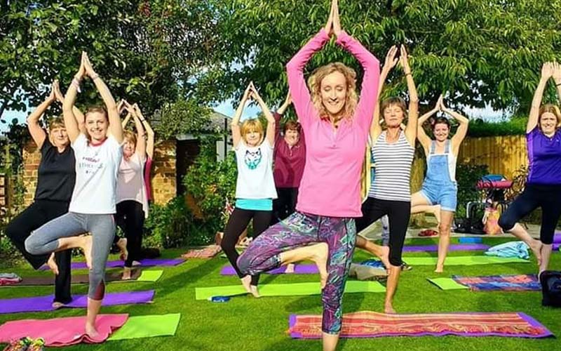Claire teaching a group yoga class in Leicestershire